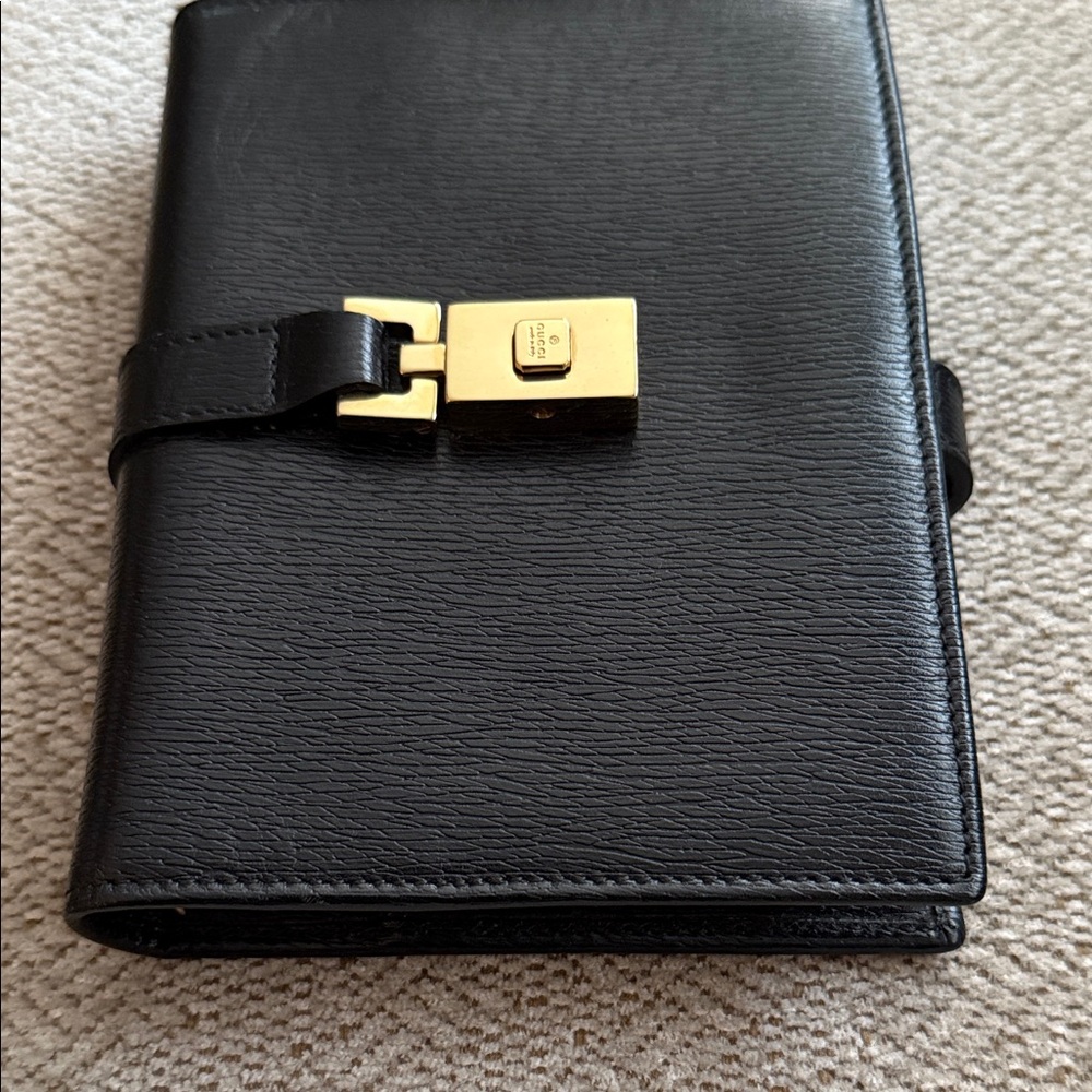 Authentic Gucci Elegant Black Organizer with Gold Accents